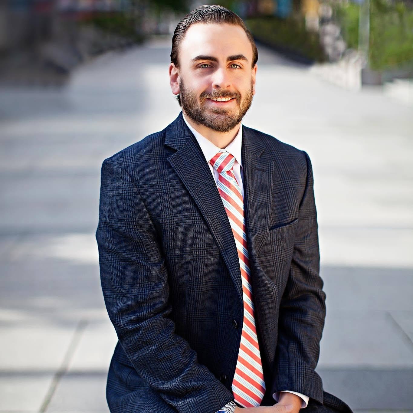 Ben Mathis wearing a navy suit